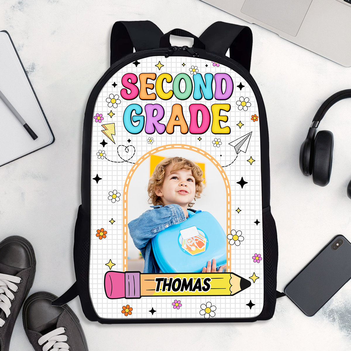 Personalized kids backpack with drawing design and custom name, perfect for school.