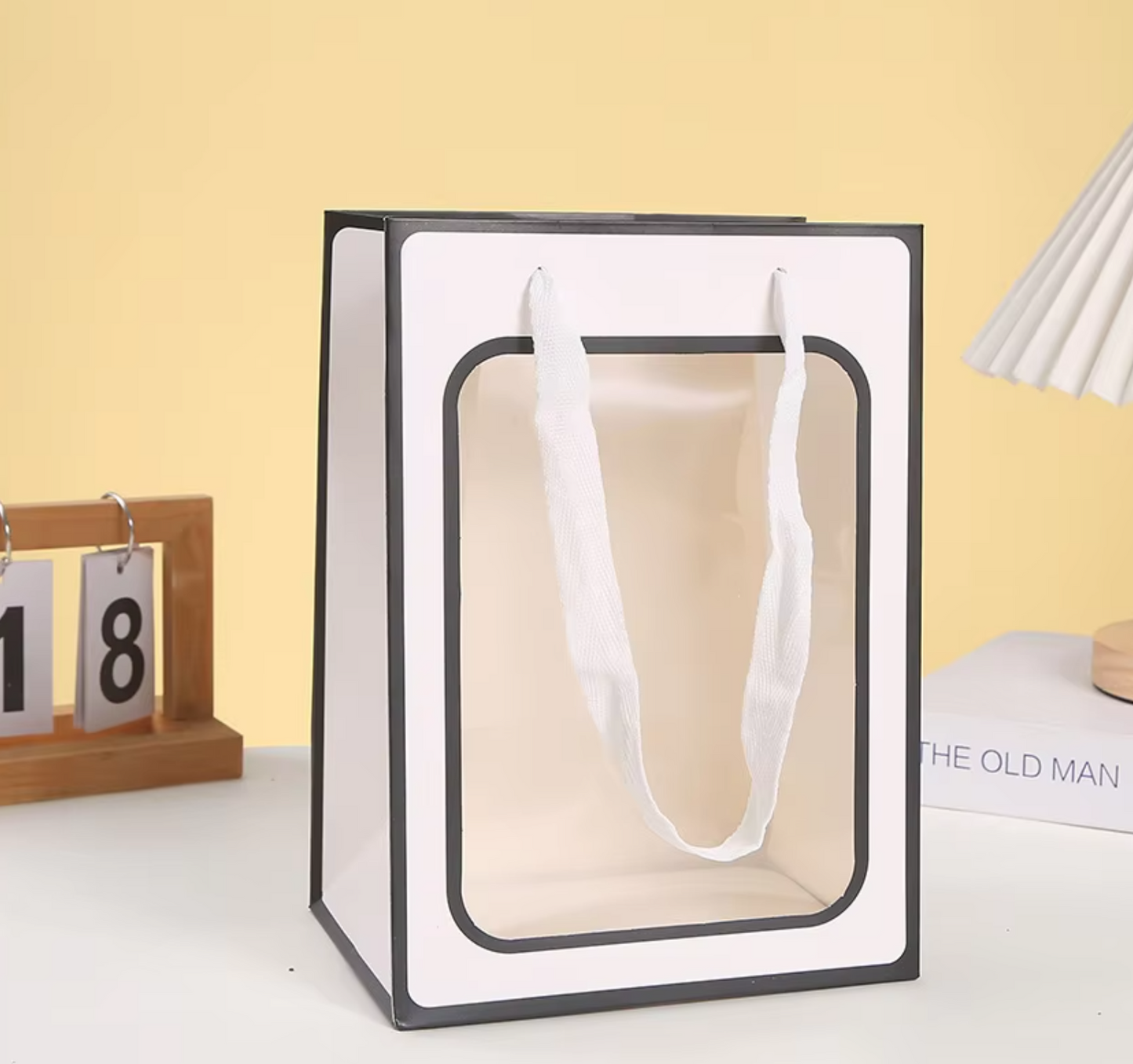 Personalized gift bag with custom name and design.