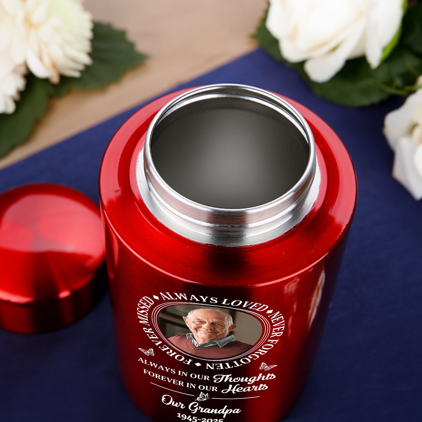 Stainless steel keepsake urn with "Always Loved, Never Forgotten" memorial design.