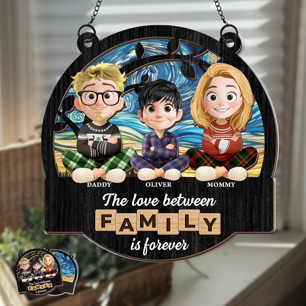 Personalized family love suncatcher ornament hanging in a window, custom family names.