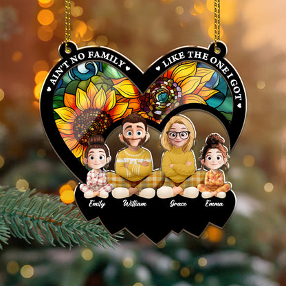 Personalized "Ain't No Family Like The One I Got" suncatcher ornament hanging in a window.