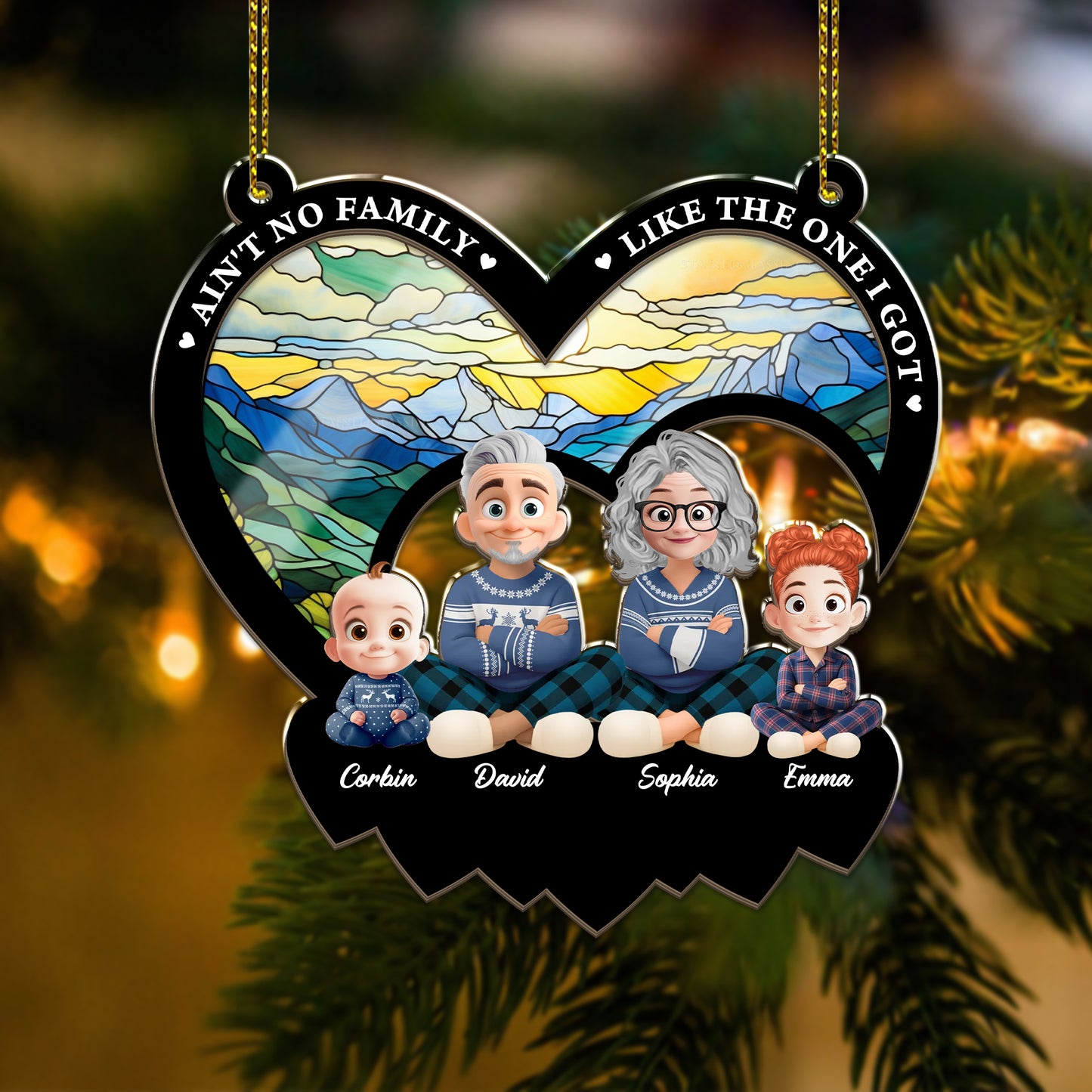 Personalized "Ain't No Family Like The One I Got" suncatcher ornament hanging in a window.