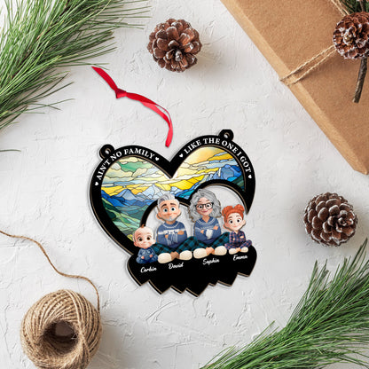 Personalized "Ain't No Family Like The One I Got" suncatcher ornament hanging in a window.