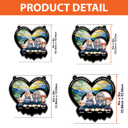 Personalized "Ain't No Family Like The One I Got" suncatcher ornament hanging in a window.