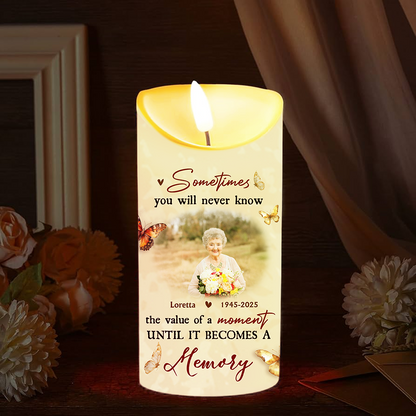 Personalized Photo LED Candle flickering with a custom image, creating a warm memorial keepsake.