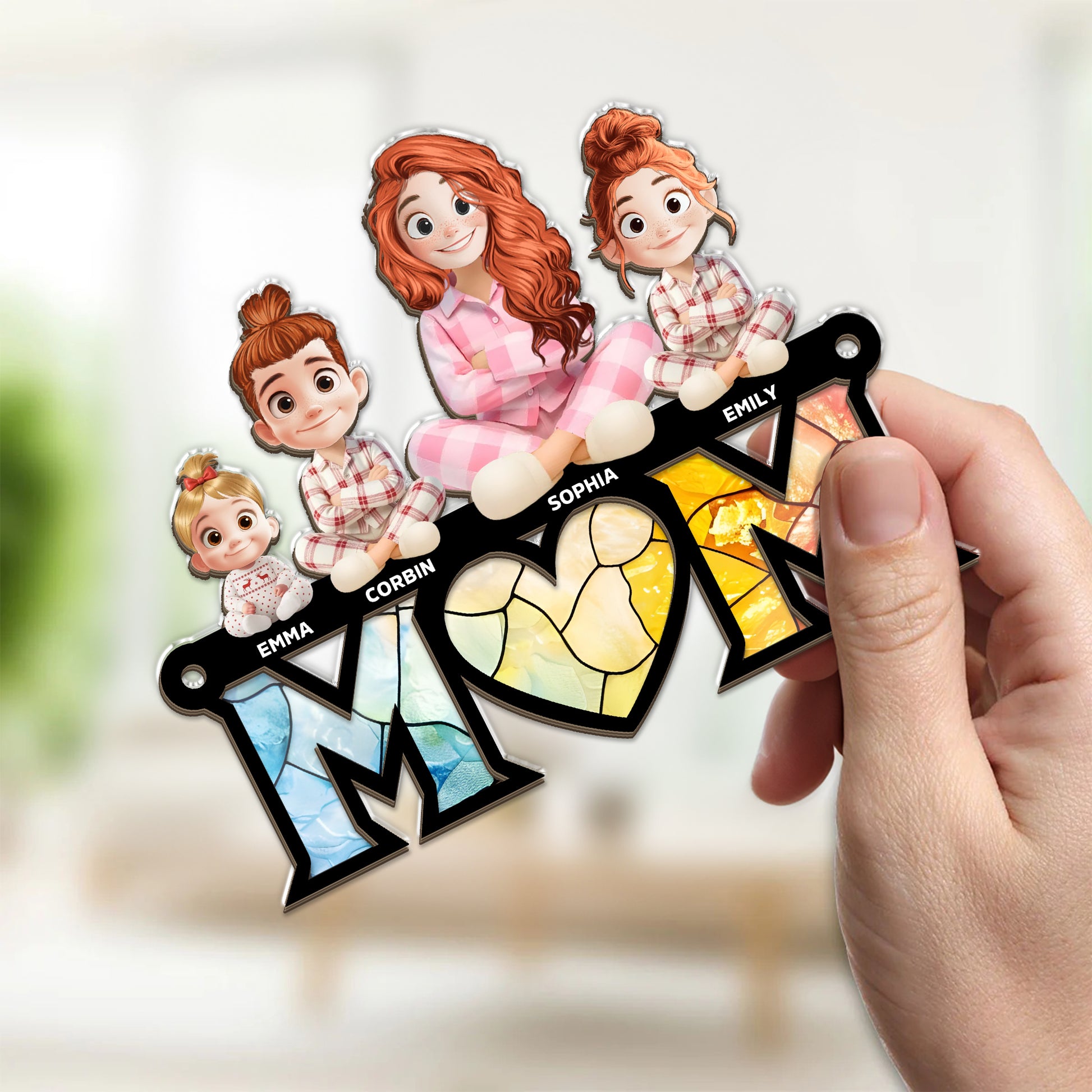 Best Mom Ever personalized suncatcher ornament hanging in a window.