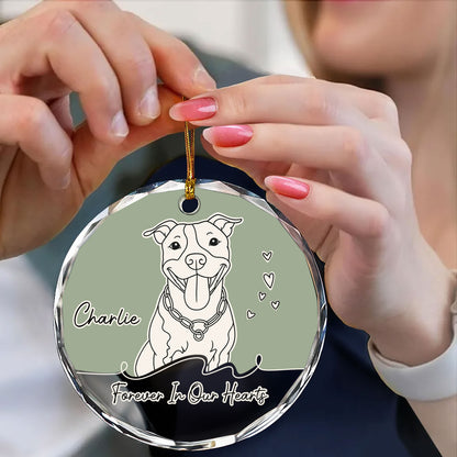 Personalized glass ornament featuring custom line art of a dog and cat, a unique Christmas gift.