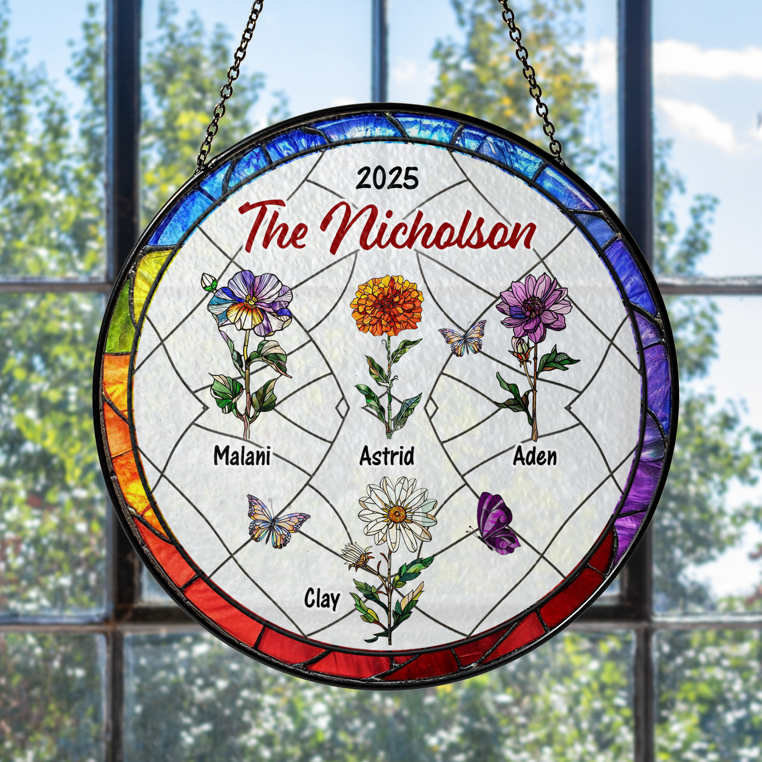 Family flowers personalized photo stained glass suncatcher hanging in a window.