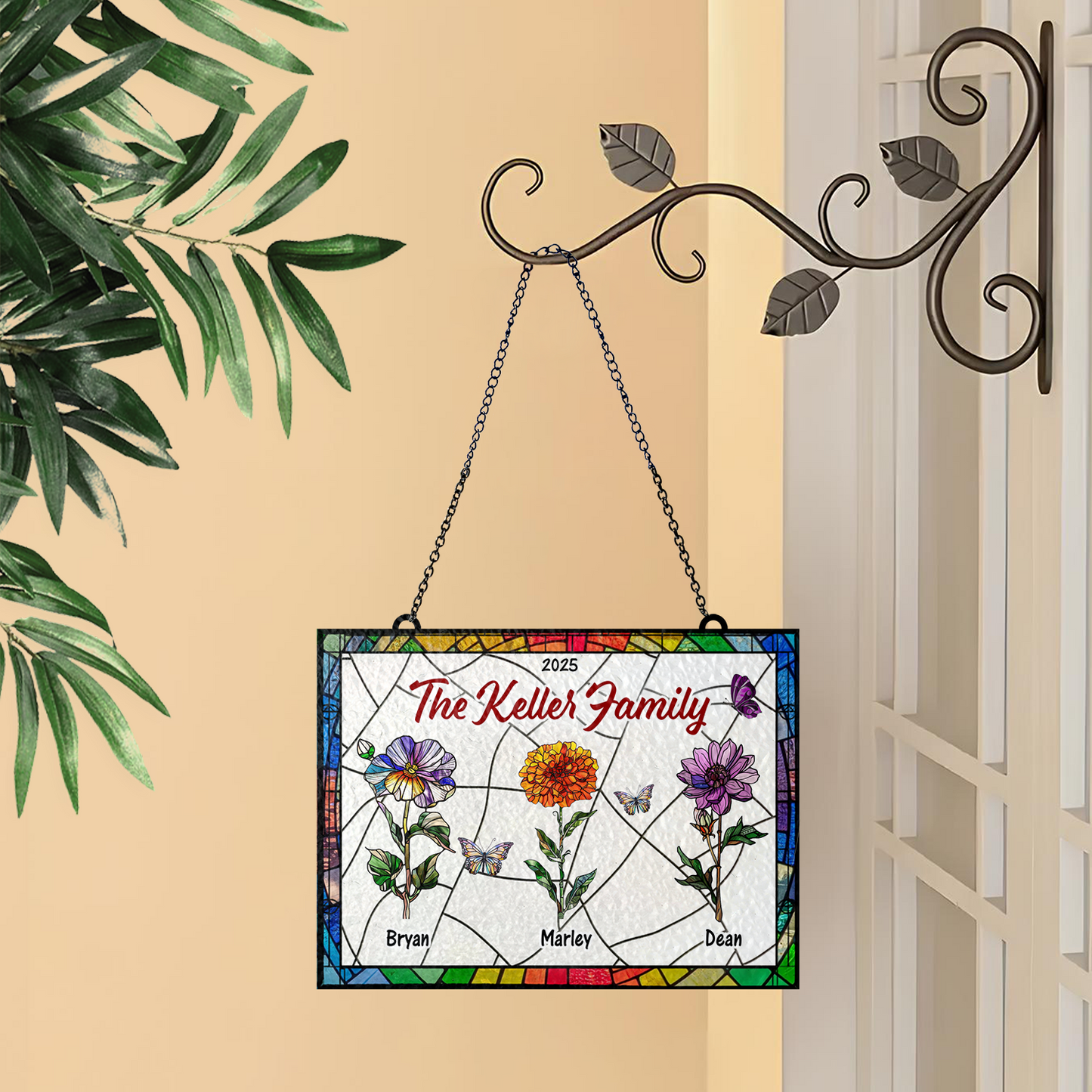 Family flowers personalized photo stained glass suncatcher hanging in a window.