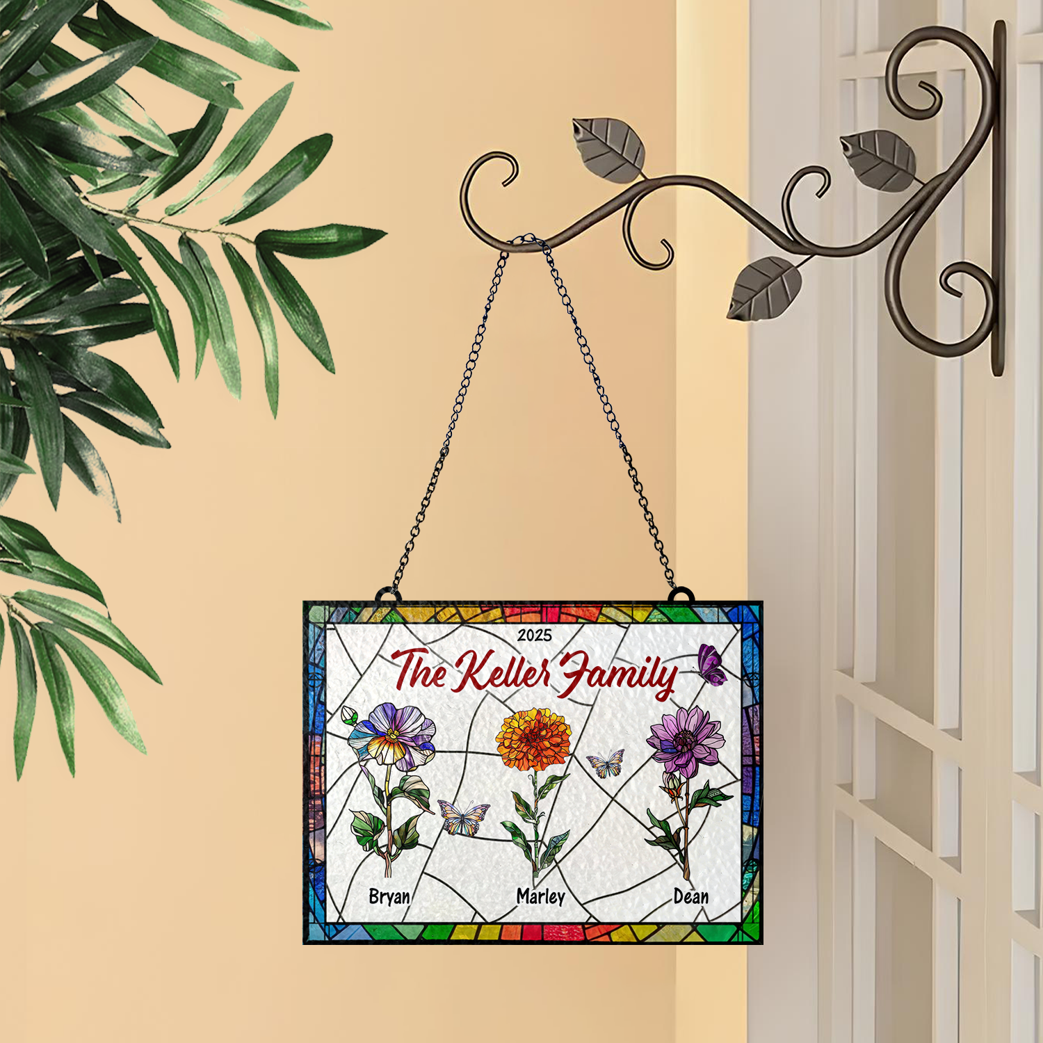 Family flowers personalized photo stained glass suncatcher hanging in a window.