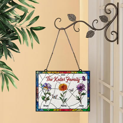 Family flowers personalized photo stained glass suncatcher hanging in a window.