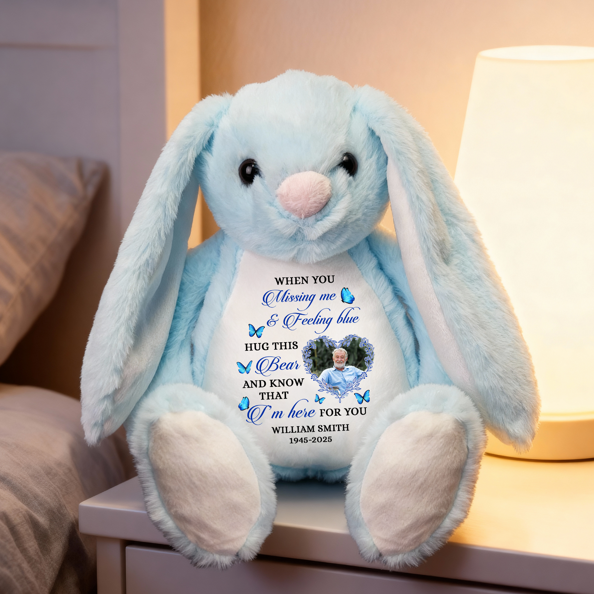 Blue memorial plush bunny rabbit with a Christmas hat and angel wings, a comforting keepsake.