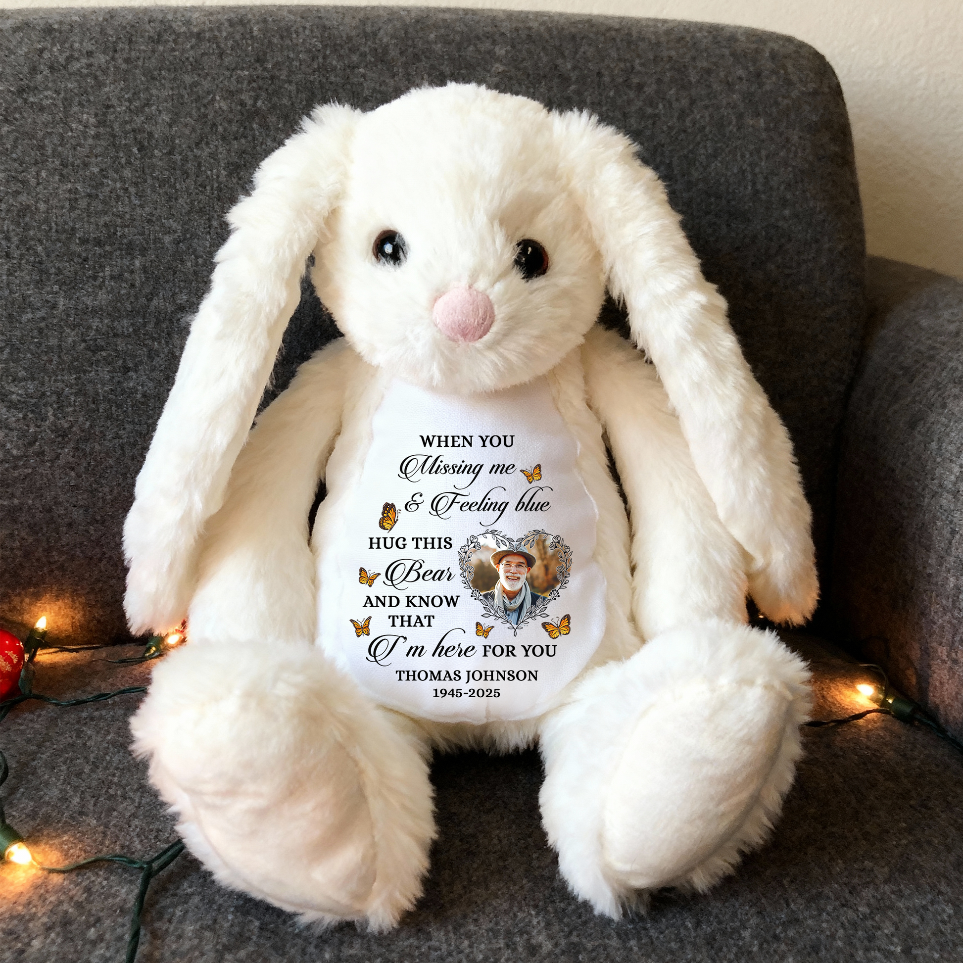 Blue memorial plush bunny rabbit with a Christmas hat and angel wings, a comforting keepsake.