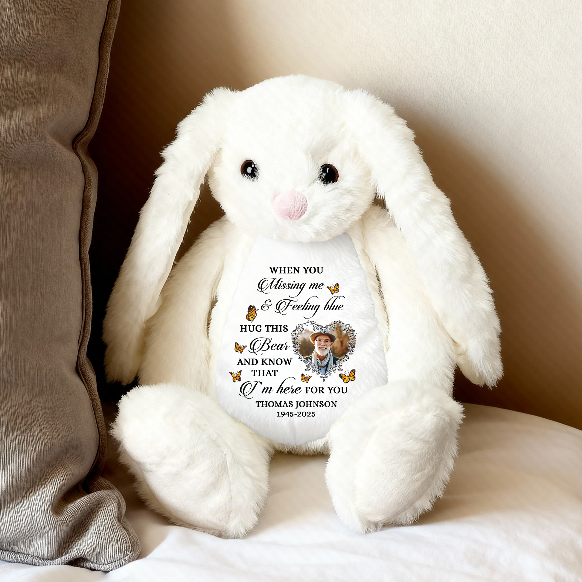 Blue memorial plush bunny rabbit with a Christmas hat and angel wings, a comforting keepsake.