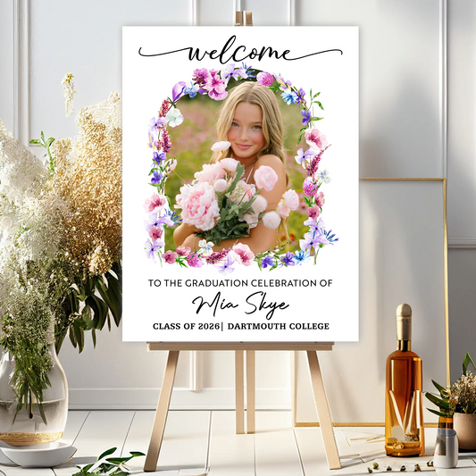 Personalized graduation welcome sign with flowers and custom photo.