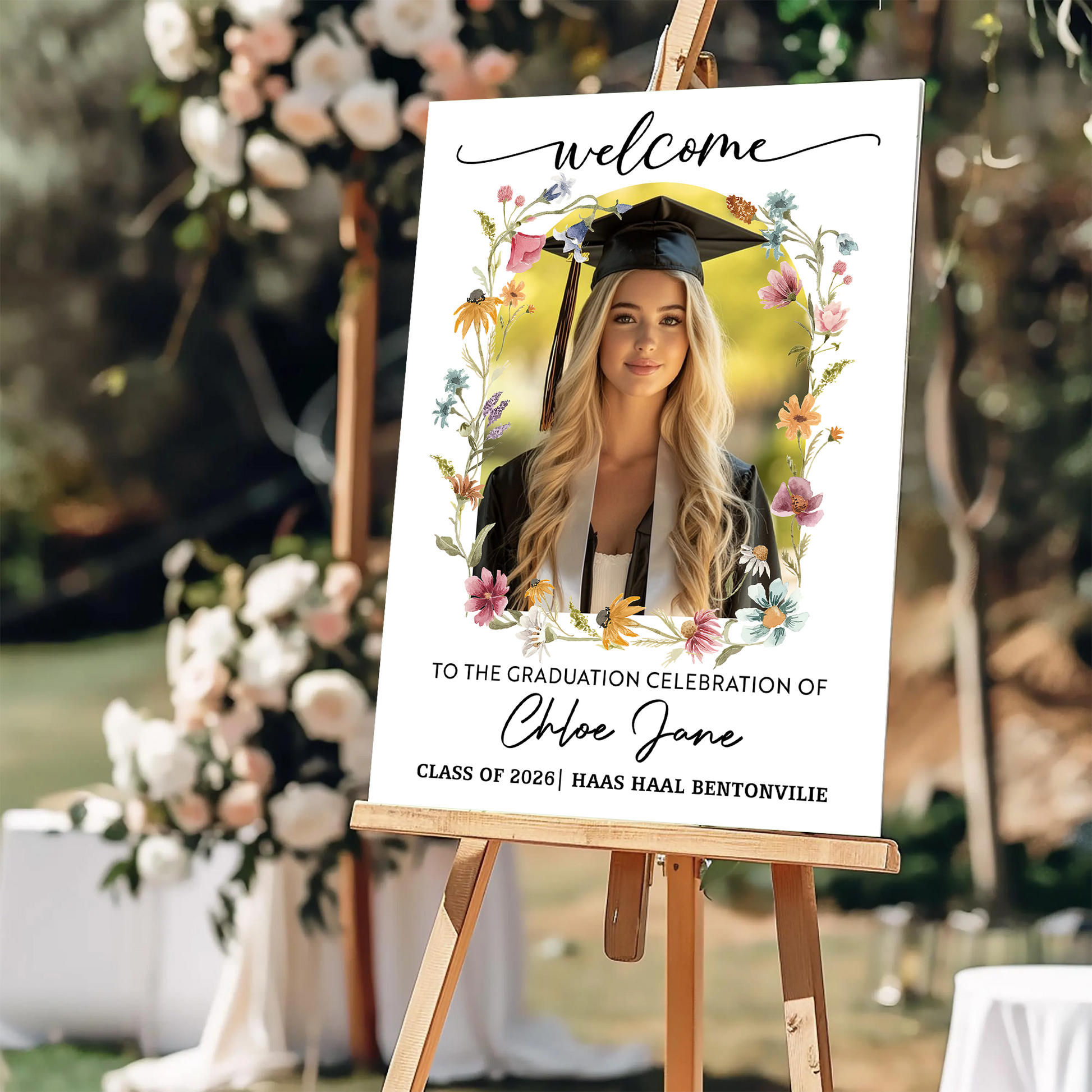 Personalized graduation welcome sign with flowers and custom photo.