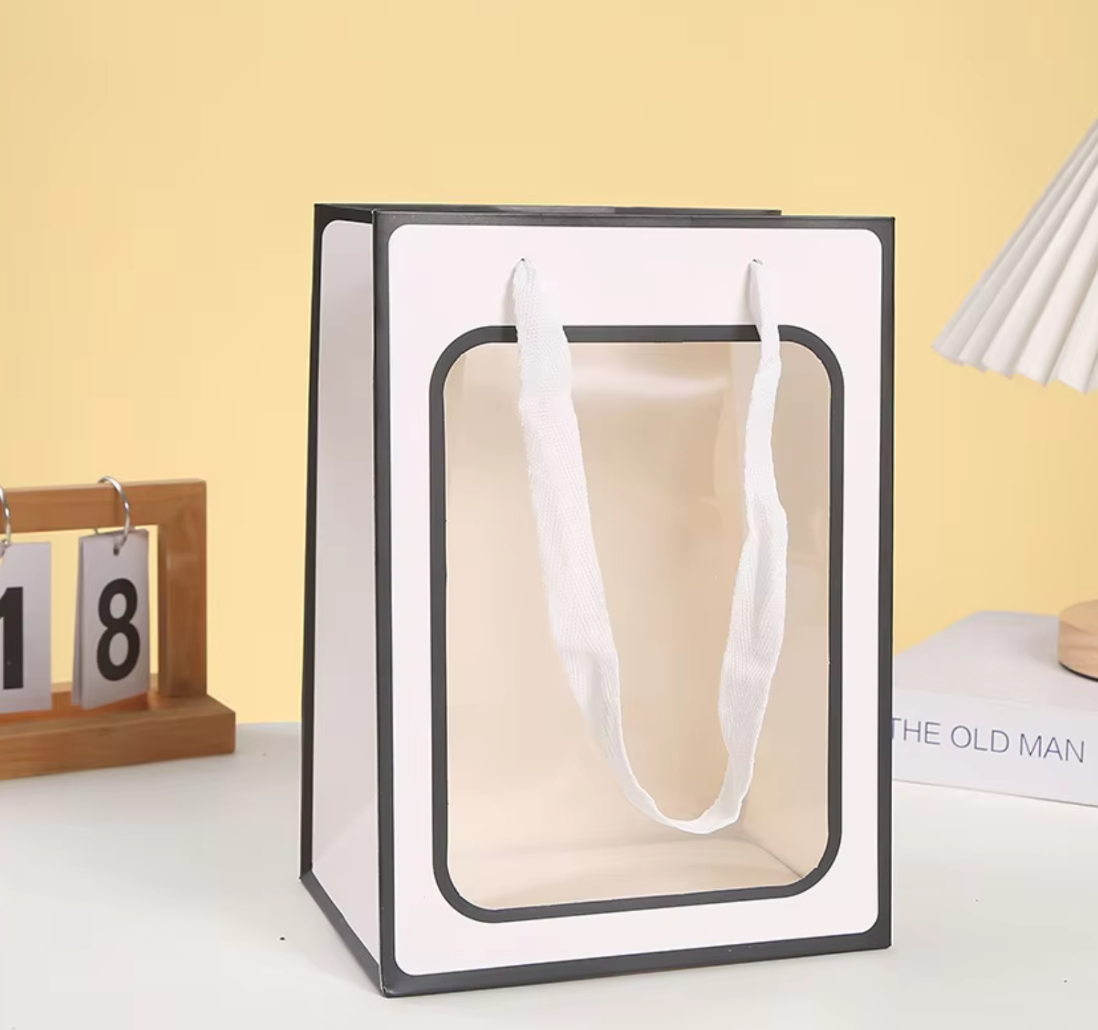 Personalized gift bag with custom name and design.