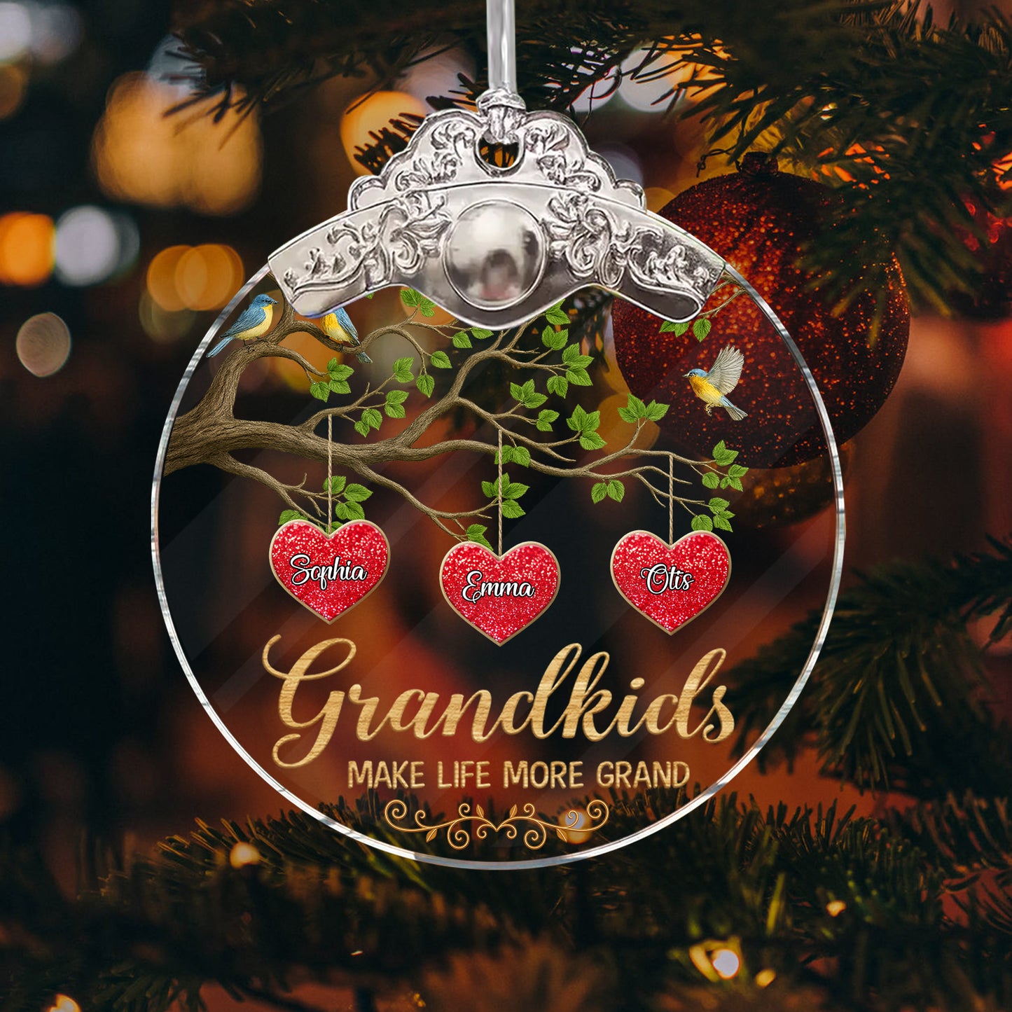 Personalized "Grandkids Make Life Grand" glass ornament with a silver and gold cap, showcasing family love.