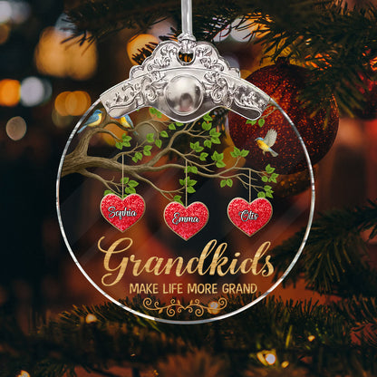 Personalized "Grandkids Make Life Grand" glass ornament with a silver and gold cap, showcasing family love.