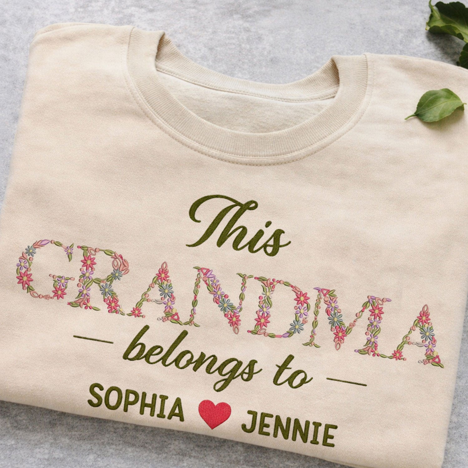 Grandma Belongs To floral embroidered crewneck sweatshirt.