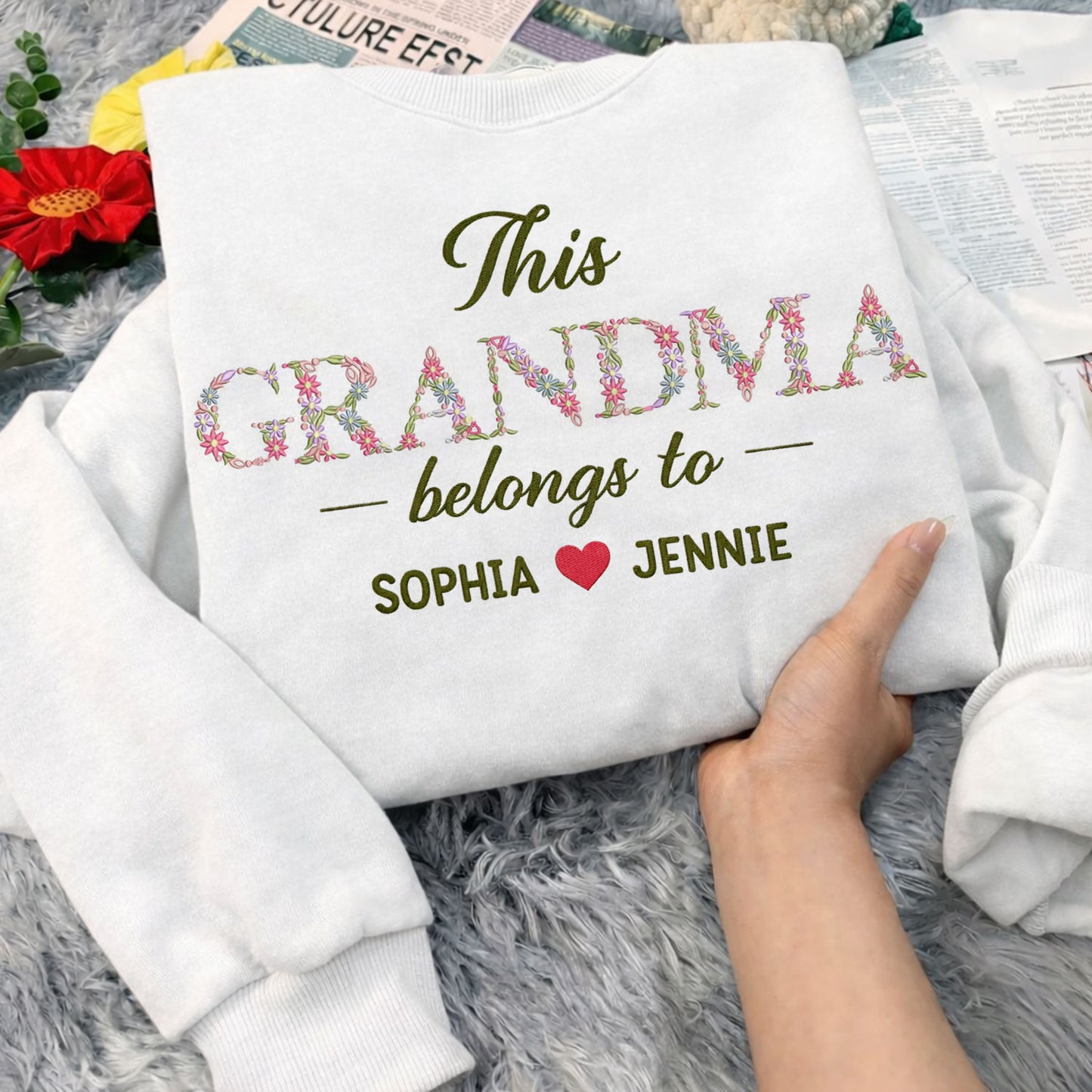 Grandma Belongs To floral embroidered crewneck sweatshirt.