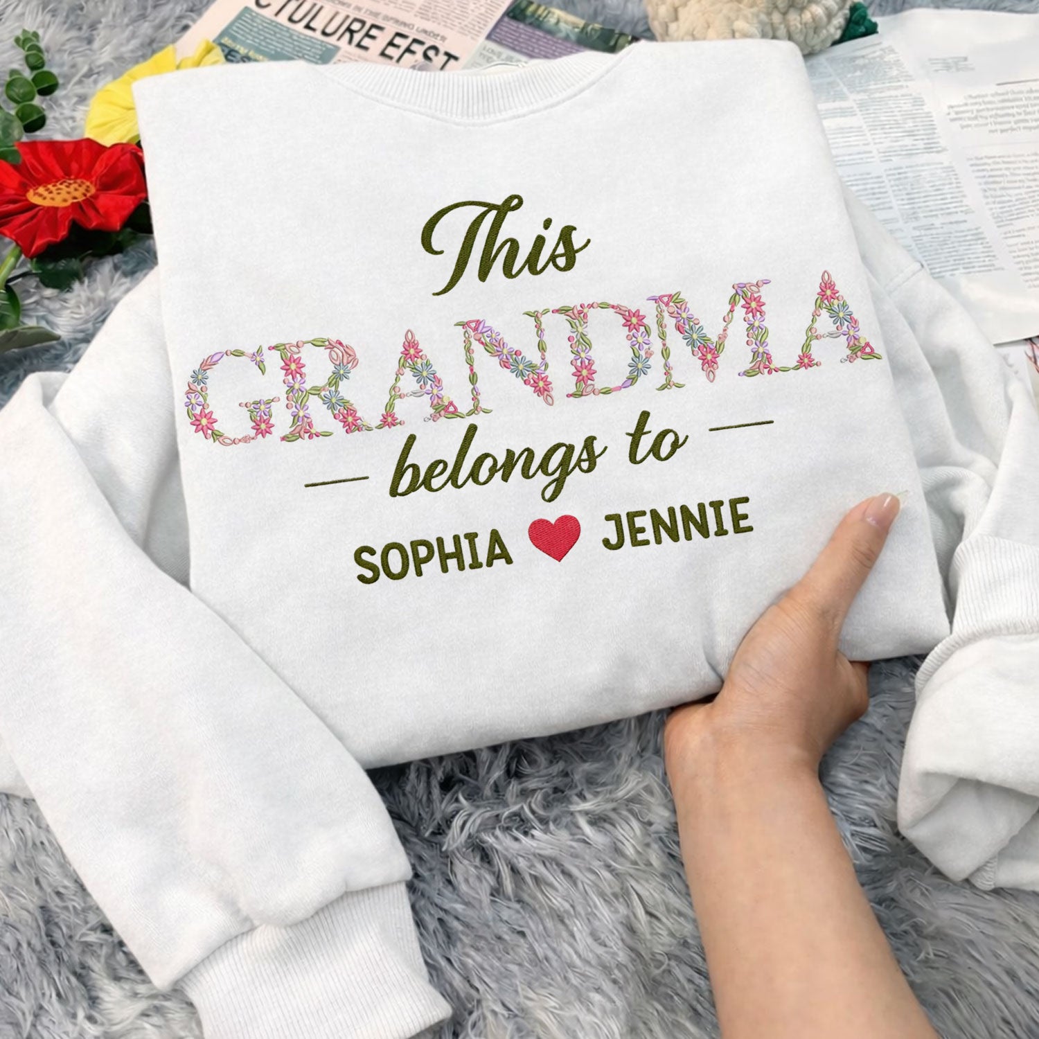 Grandma Belongs To floral embroidered crewneck sweatshirt.