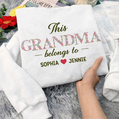 Grandma Belongs To floral embroidered crewneck sweatshirt.