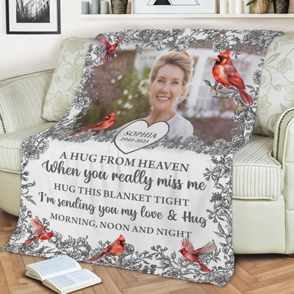 Hugs From Heaven memorial blanket with blooming flowers. A personalized sympathy gift.
