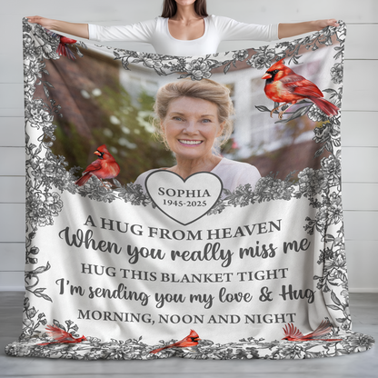 Hugs From Heaven memorial blanket with blooming flowers. A personalized sympathy gift.