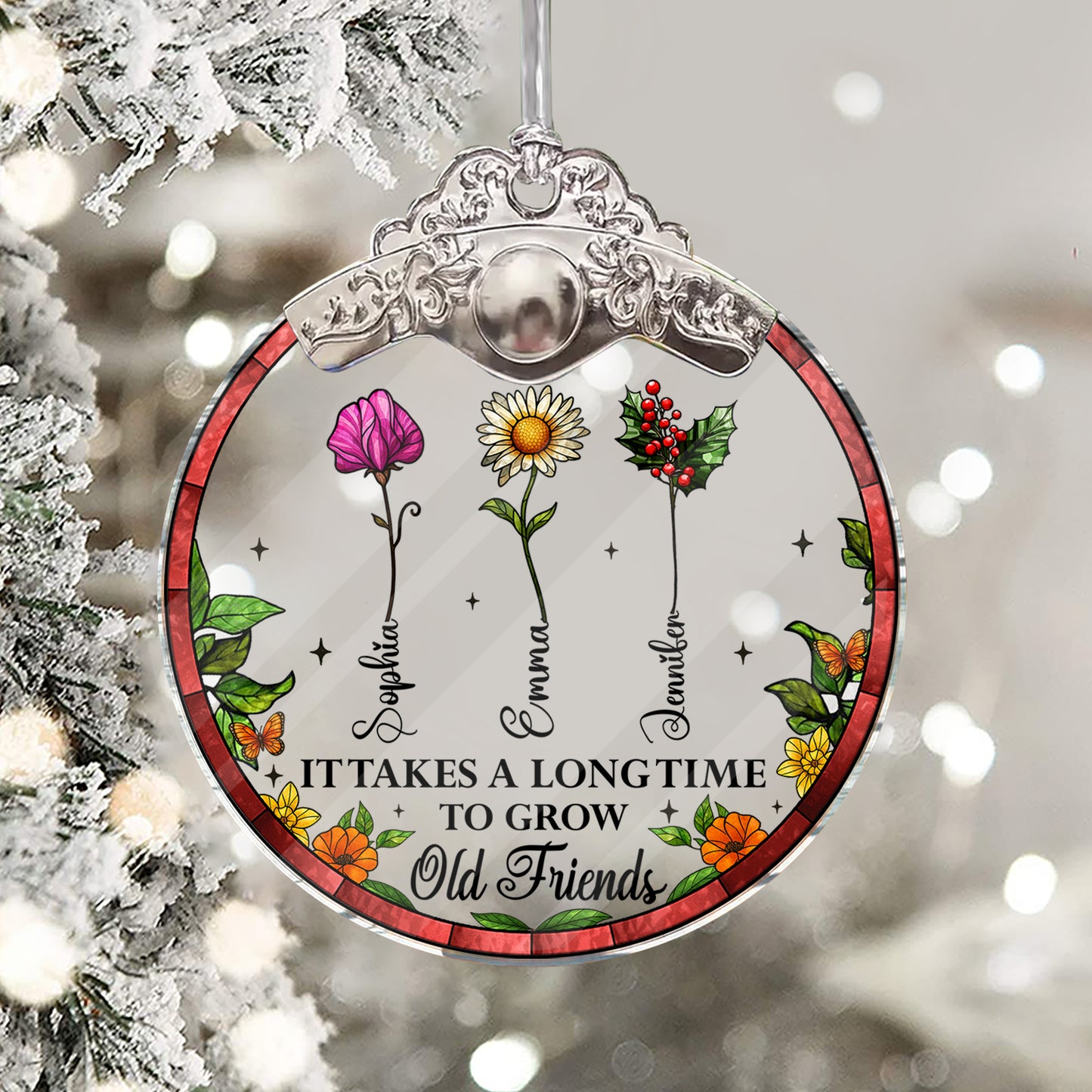 Personalized "It Takes a Long Time to Grow Old Friends" glass ornament with silver and gold cap.
