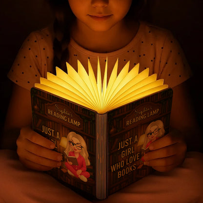 Just a Girl Who Loves Books Personalized Book Lamp, warmly lit and showcasing custom engraving.