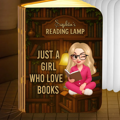 Just a Girl Who Loves Books Personalized Book Lamp, warmly lit and showcasing custom engraving.