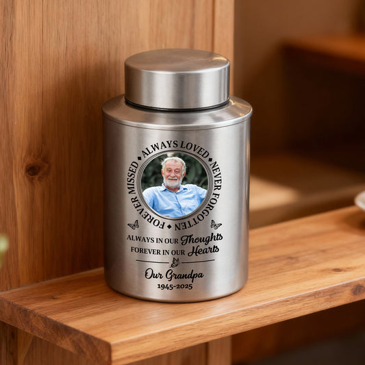 Stainless steel keepsake urn with "Always Loved, Never Forgotten" memorial design.