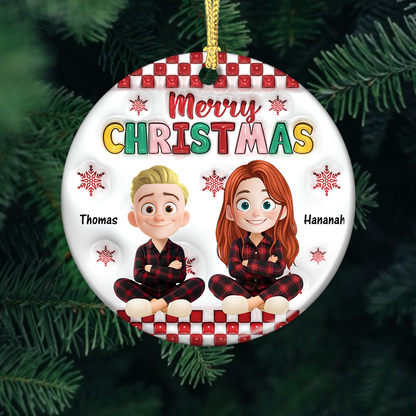 Personalized "Merry Christmas Family" ceramic ornament with custom names. A festive holiday keepsake.