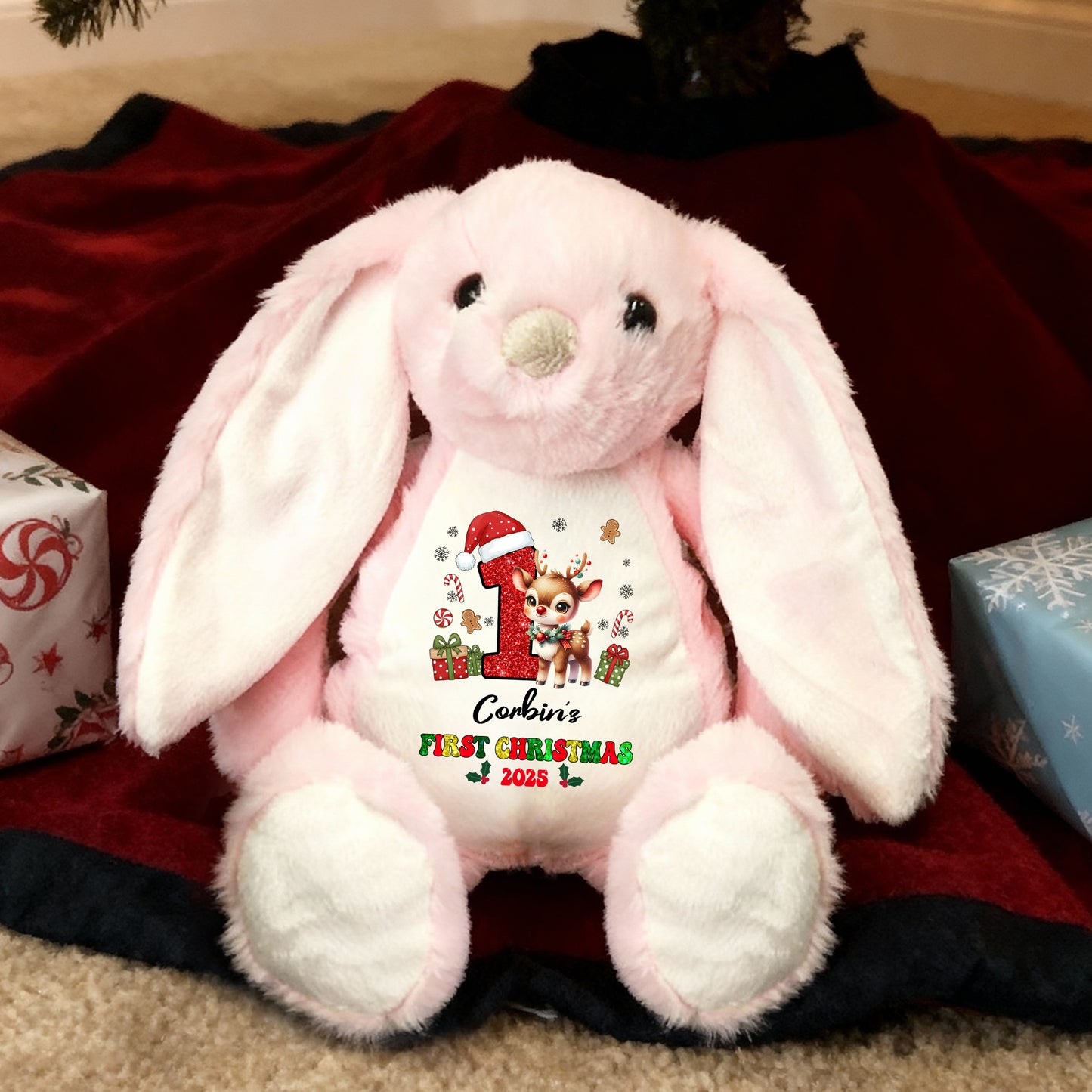 My First Christmas plush bunny rabbit with festive red bow and embroidered details.