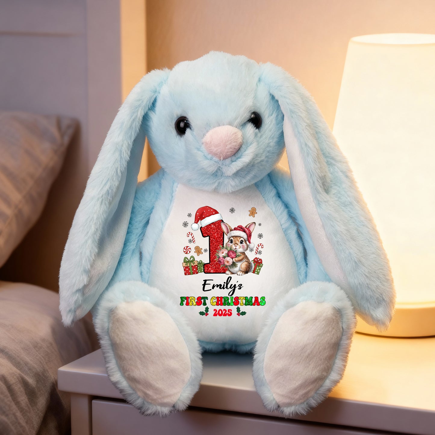 My First Christmas plush bunny rabbit with festive red bow and embroidered details.