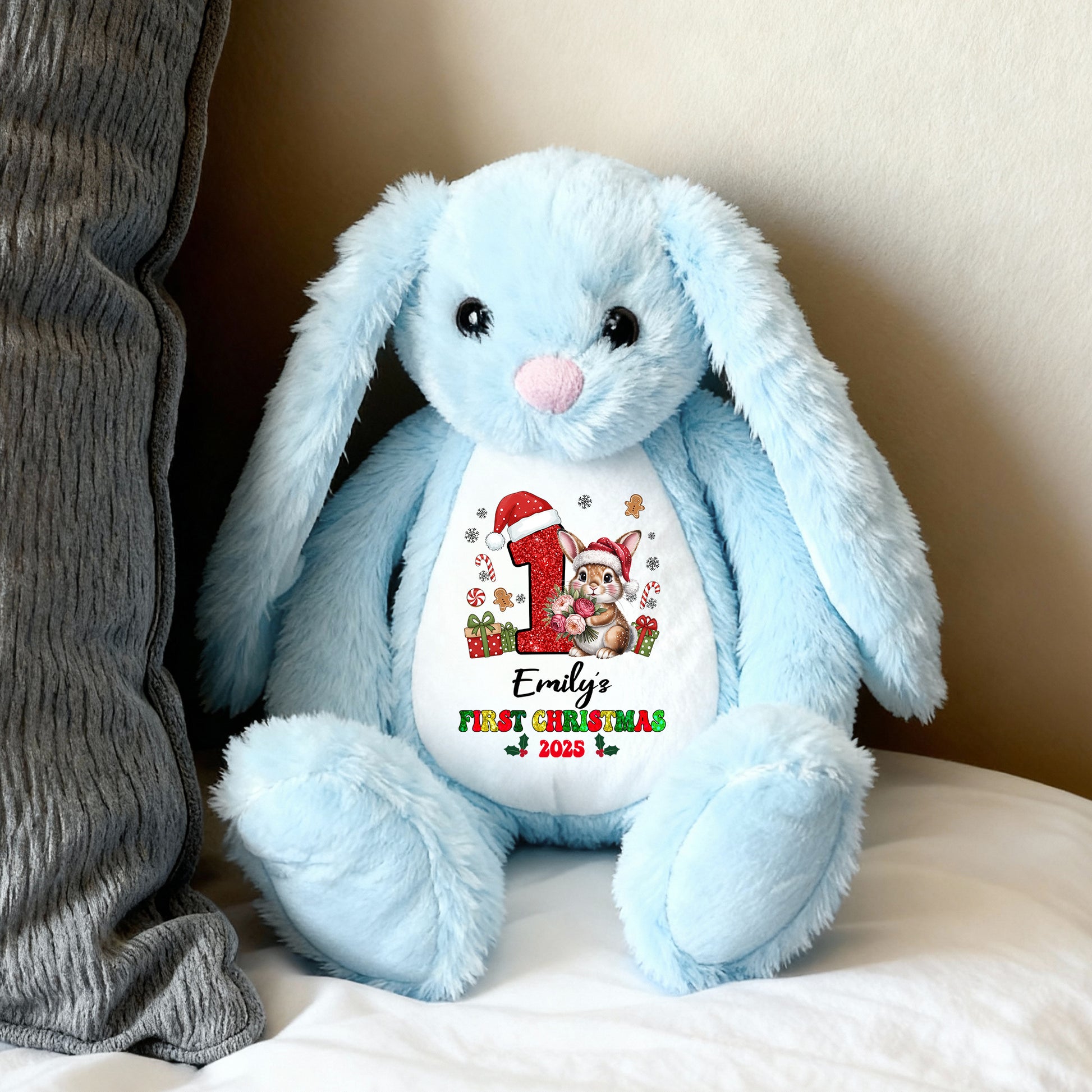 My First Christmas plush bunny rabbit with festive red bow and embroidered details.