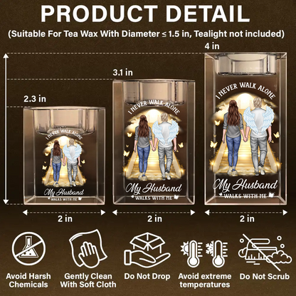 Personalized crystal candle holder with "Never Walk Alone" engraving, shimmering beautifully.