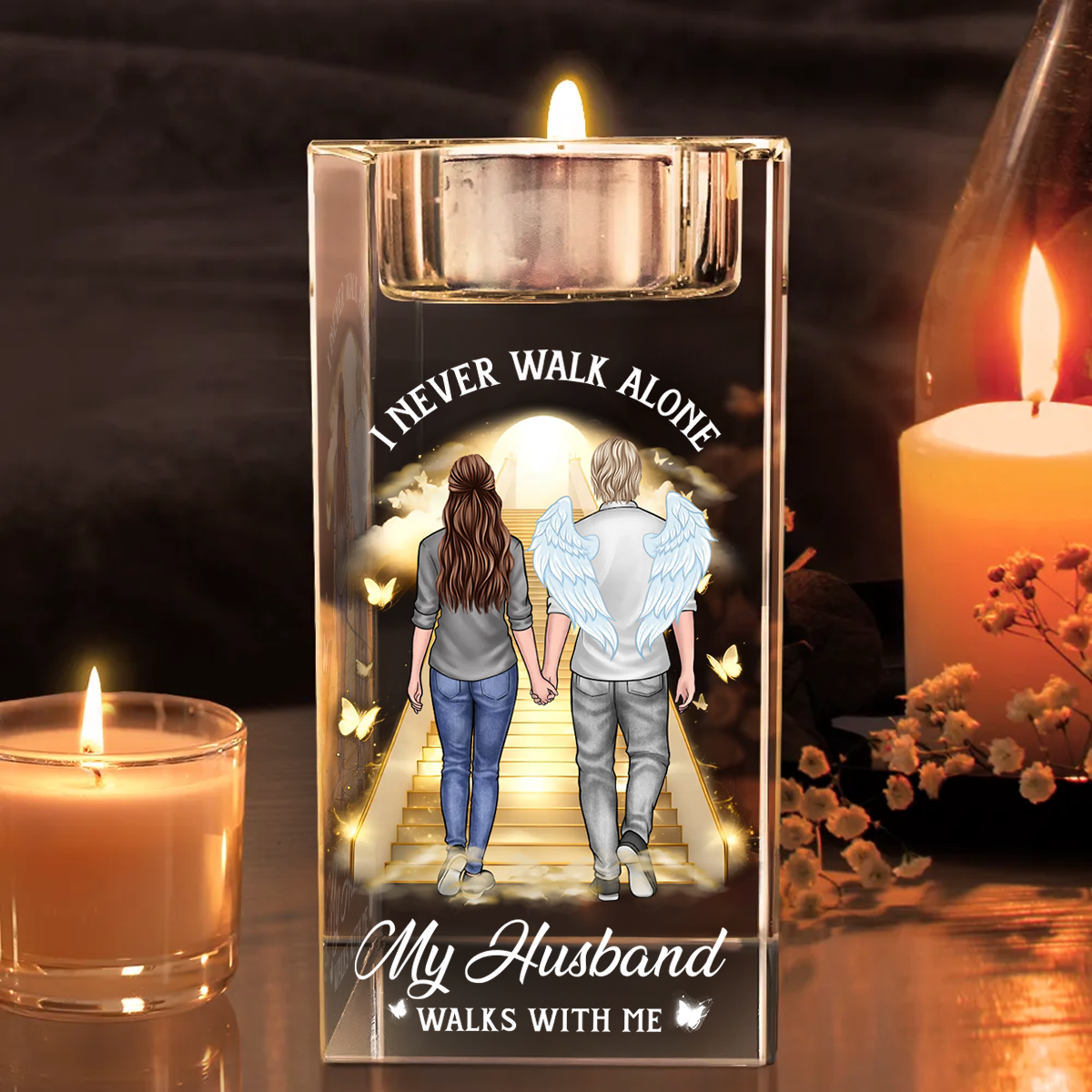 Personalized crystal candle holder with "Never Walk Alone" engraving, shimmering beautifully.