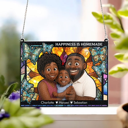 Personalized family photo stained glass suncatcher hanging in a window, creating colorful light.