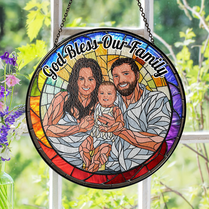 Personalized family photo stained glass suncatcher hanging in a window.