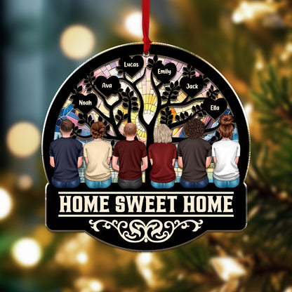 Personalized "Our Family This Christmas" window suncatcher ornament hanging.