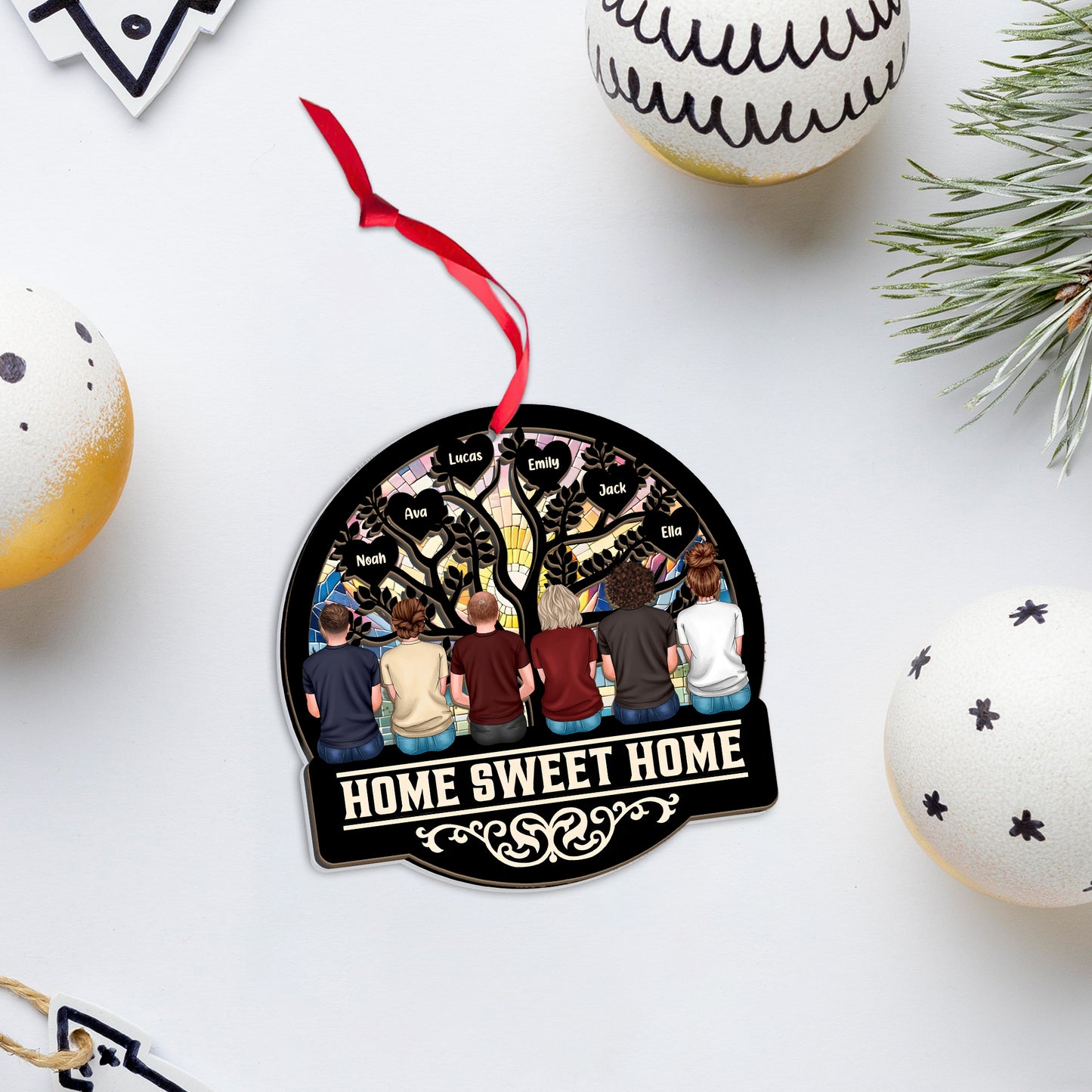 Personalized "Our Family This Christmas" window suncatcher ornament hanging.