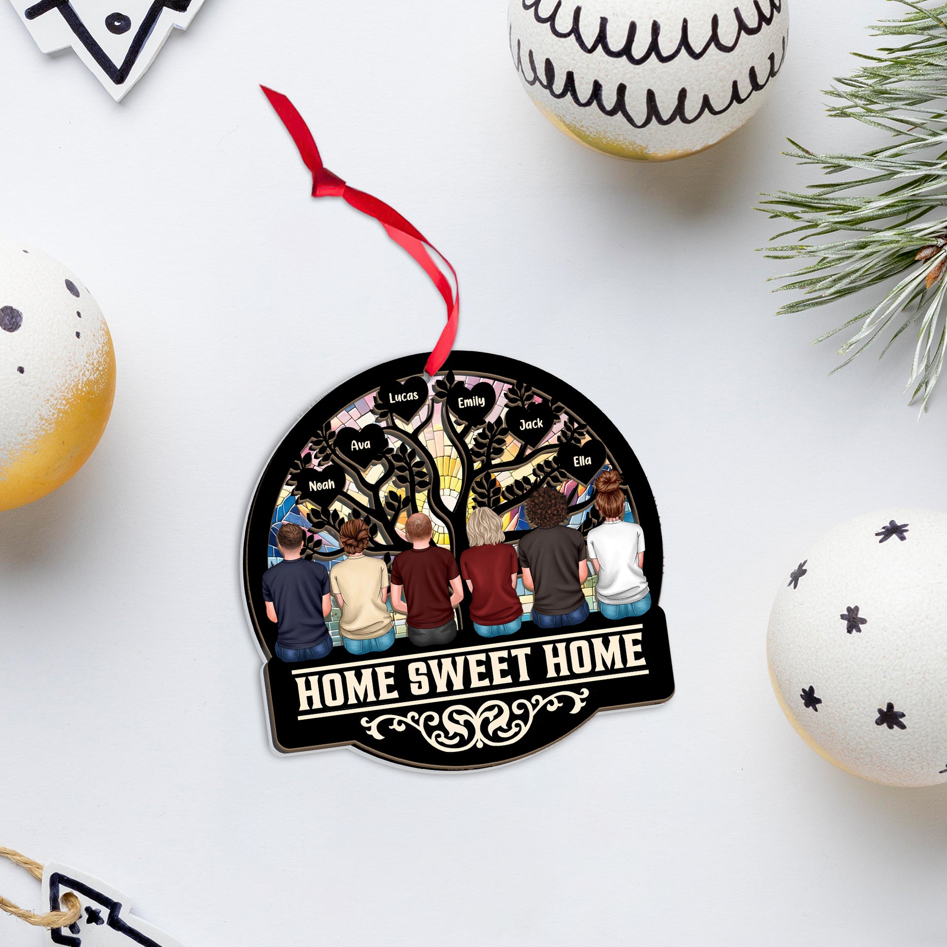 Personalized "Our Family This Christmas" window suncatcher ornament hanging.