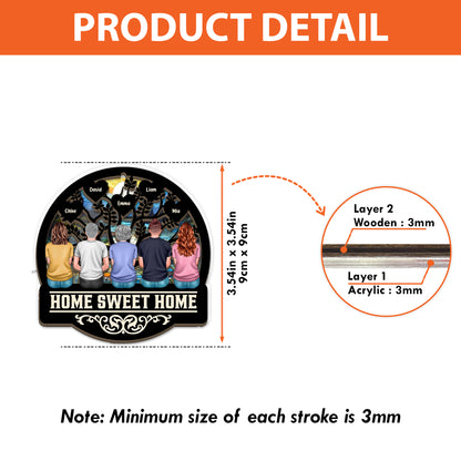 Personalized "Our Family This Christmas" window suncatcher ornament hanging.