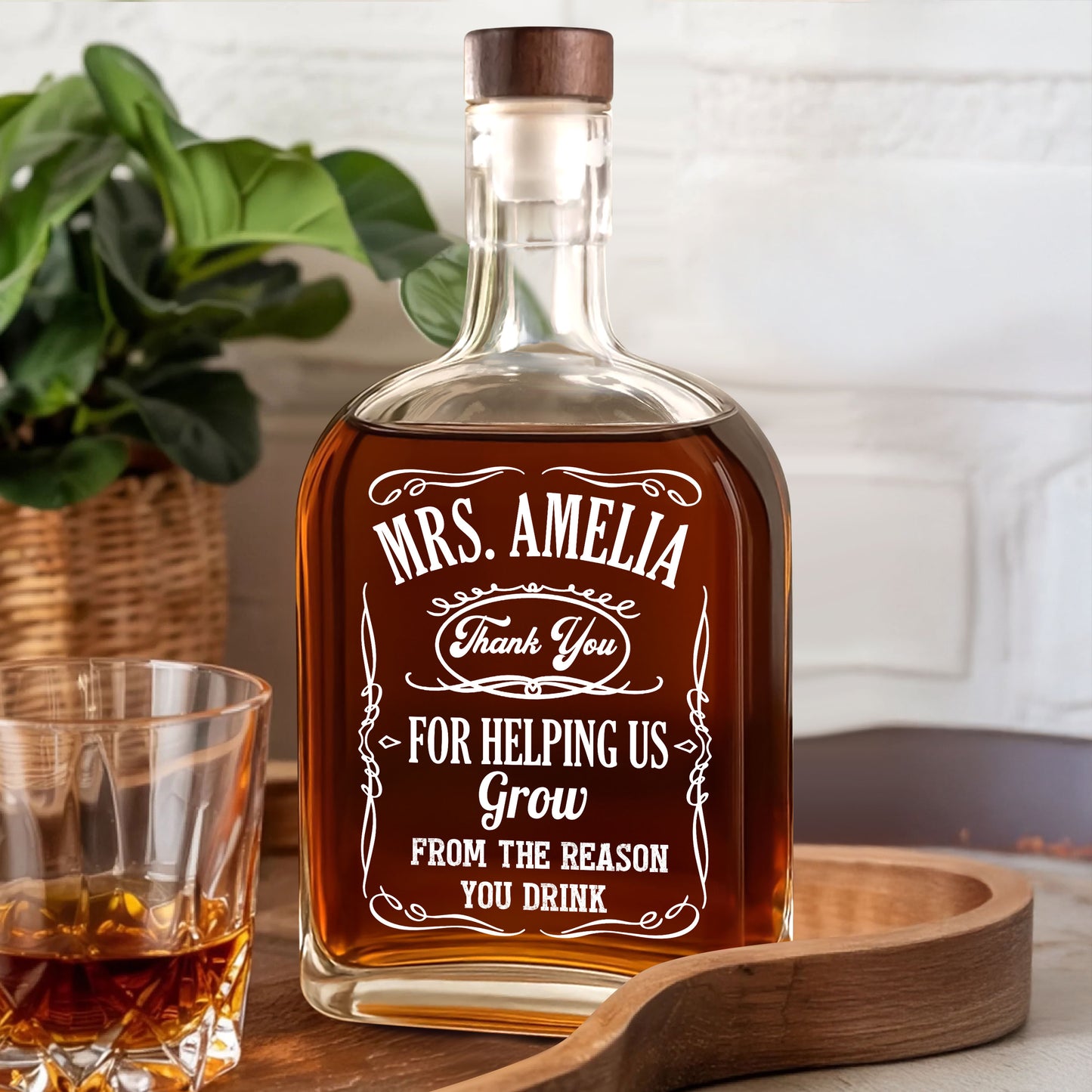 Personalized whiskey bottle for teachers, engraved with a custom design.