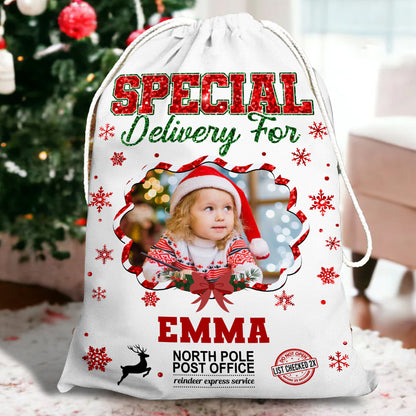 Personalized Christmas glitter bag with a family name, festive sack for holiday gifts.