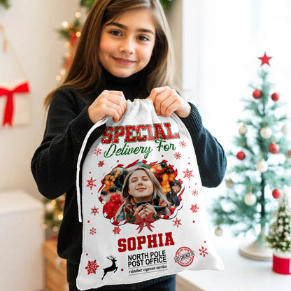 Personalized Christmas glitter bag with a family name, festive sack for holiday gifts.