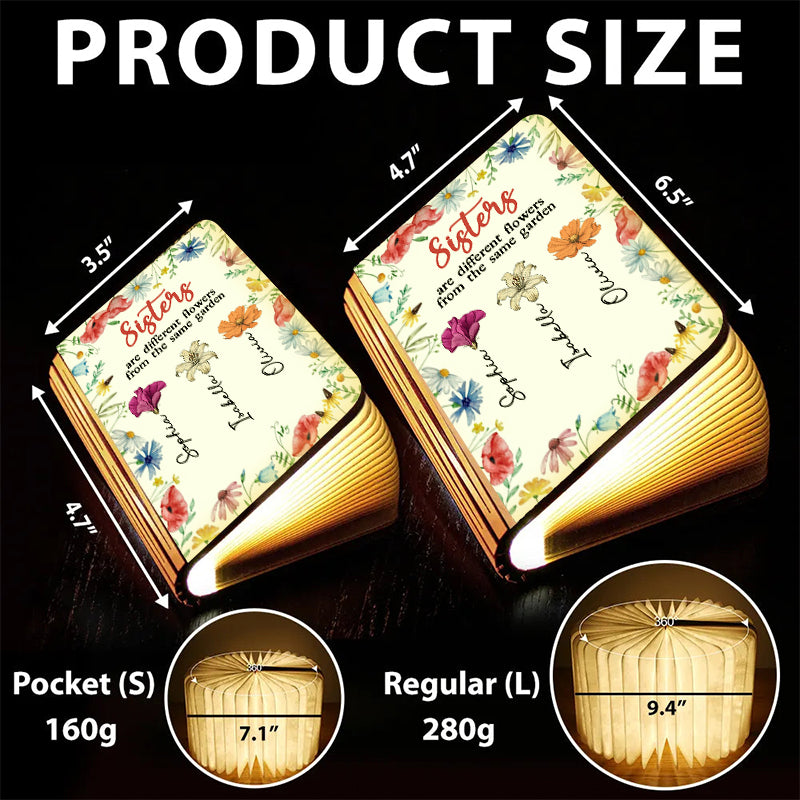 Sisters Are Different Flowers Personalized Book Lamp, showcasing custom engraving and warm light.