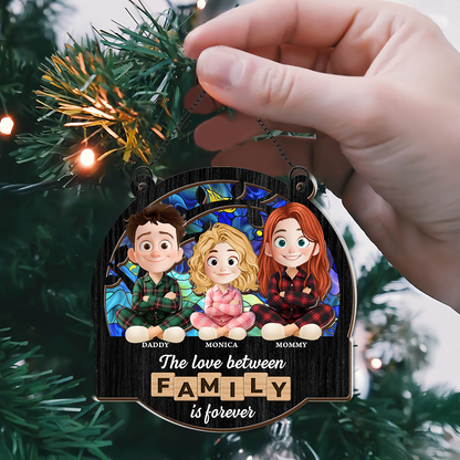 Personalized family love suncatcher ornament hanging in a window, custom family names.